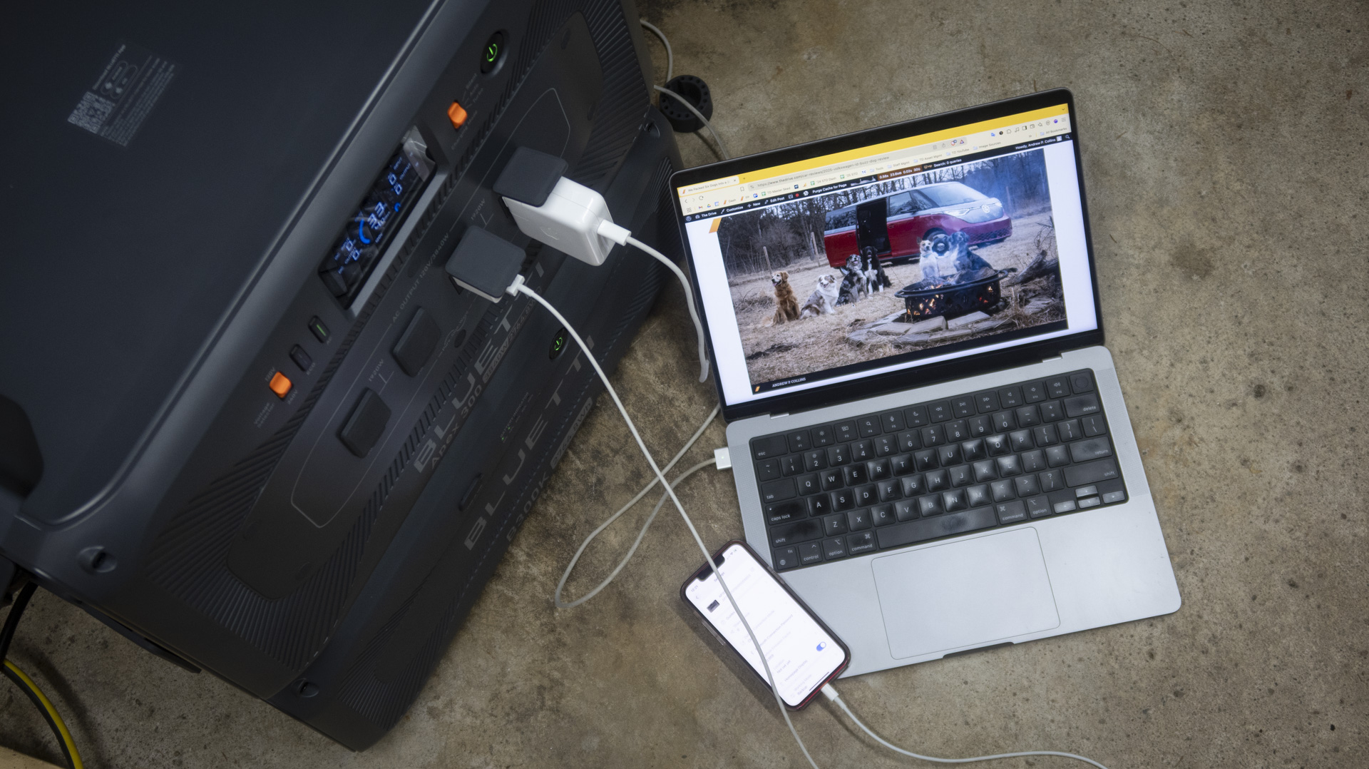 Bluetti Apex 300 portable power station running a computer and phone.