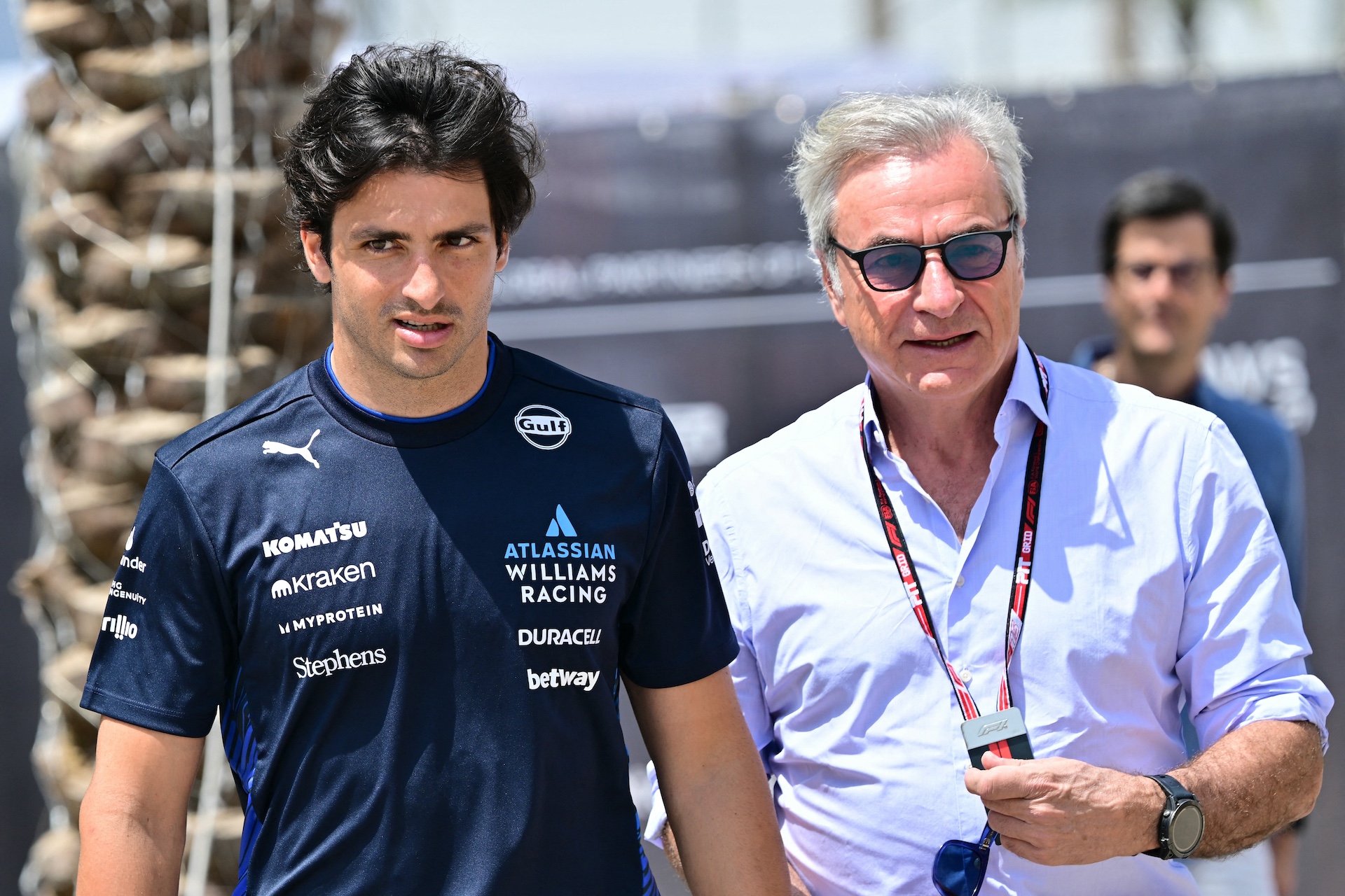 gettyimages-2209243448 Williams' Spanish driver Carlos Sainz (L) and Carlos Sainz Sr. arrive for the third practice session ahead of the Bahrain Formula One Grand Prix at the Bahrain International Circuit in Sakhir on April 12, 2025. (Photo by Giuseppe CACACE / AFP)