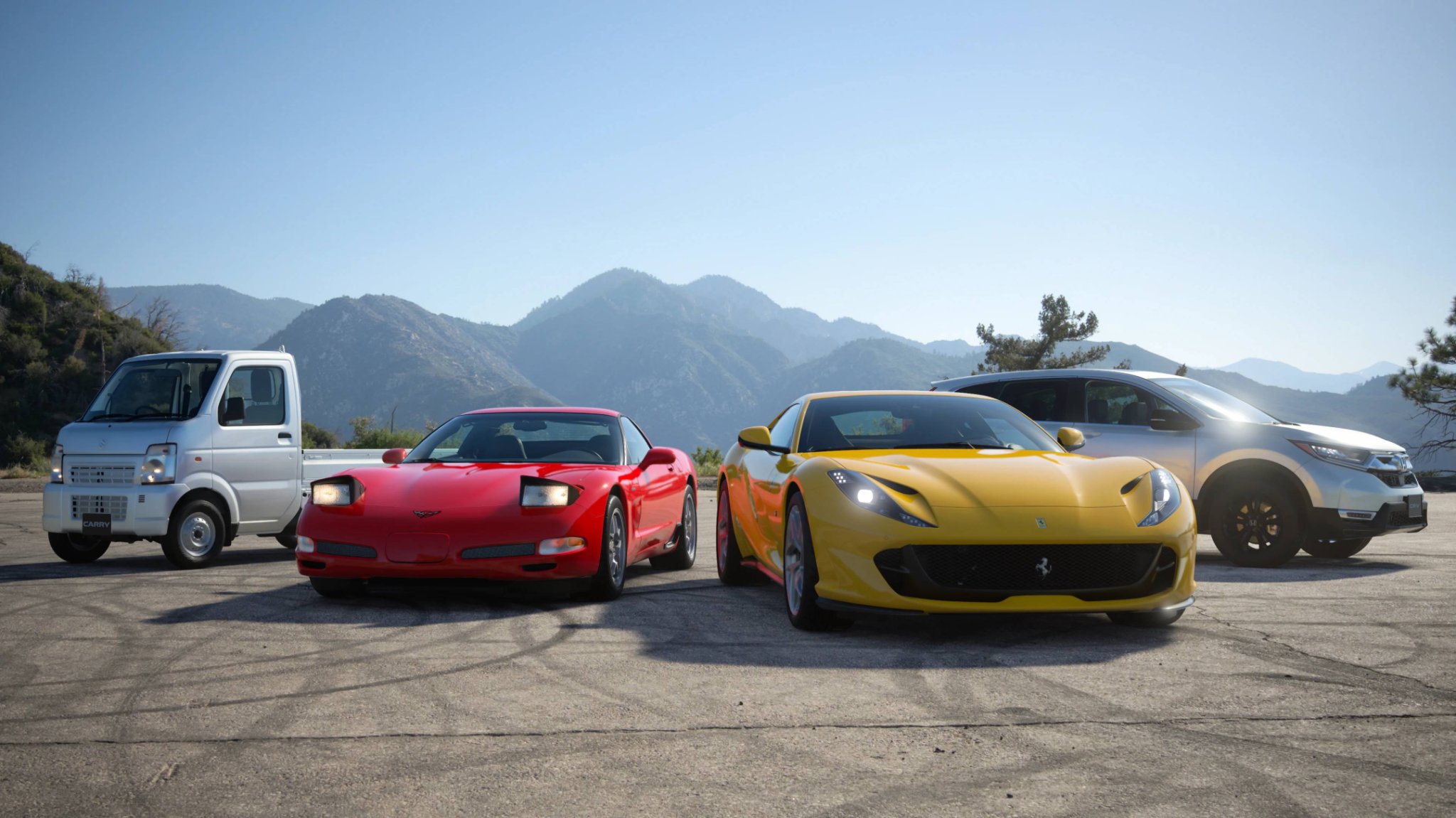 gt7-update-hero-1 A GT7 Scapes screenshot of the Ferrari 812 Superfast, C5 Chevrolet Corvette Z06, Suzuki Carry, and Honda CR-V.