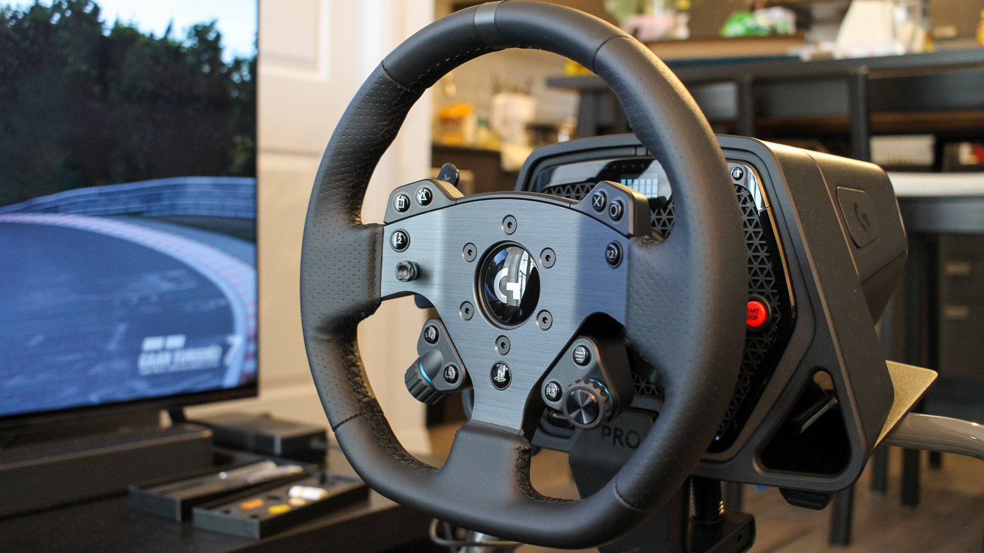 img_7803-1 Logitech G Pro racing wheel with Gran Turismo 7 running in the background.