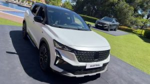 Renault Austral - White front overhead with grey in the background