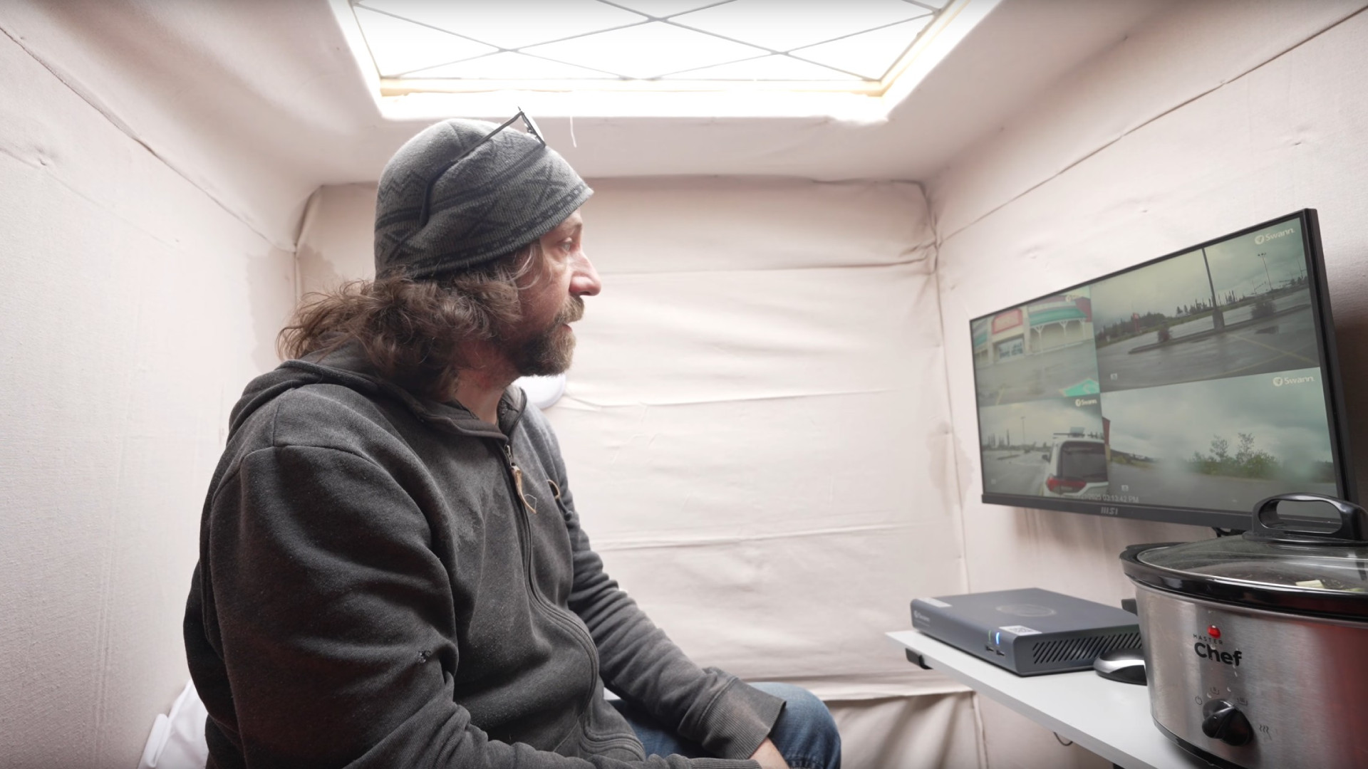 table Steve Wallis inside his camper vehicle.