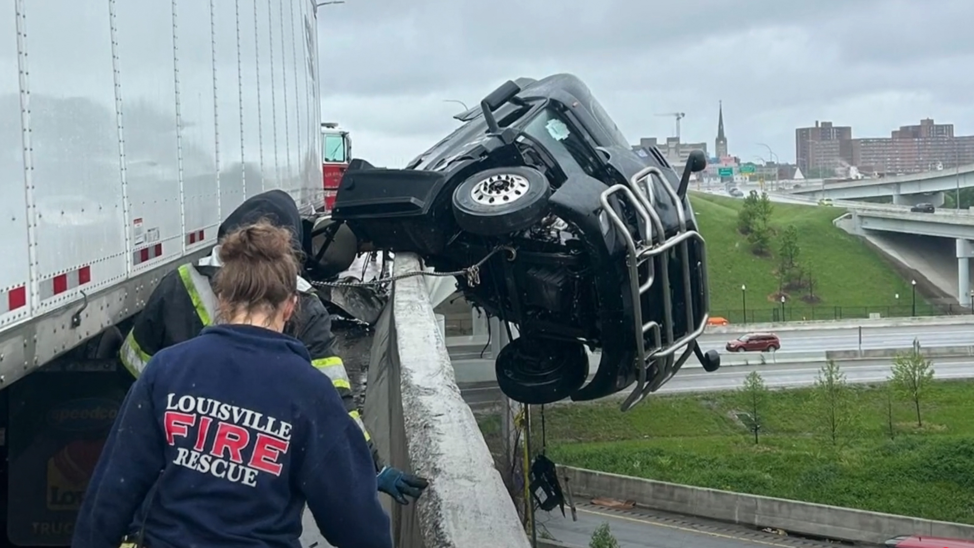 truck-bridge-crash-1-1 Commercial truck cab dangling off a bridge in Kentucky after a crash.