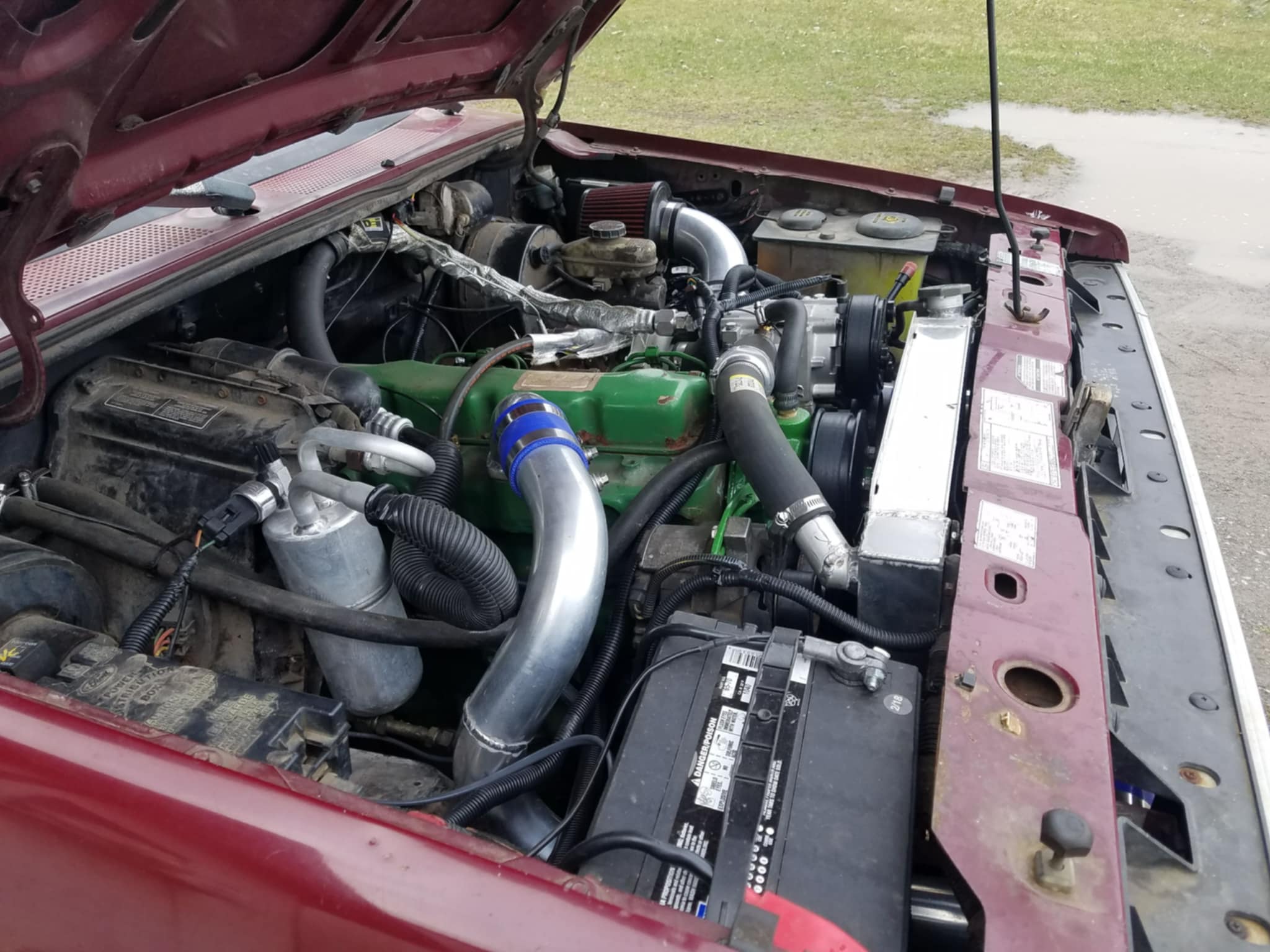 363b7919-3dad-4dda-8218-c7710be00f71 John Deere engine-swapped Ford Ranger