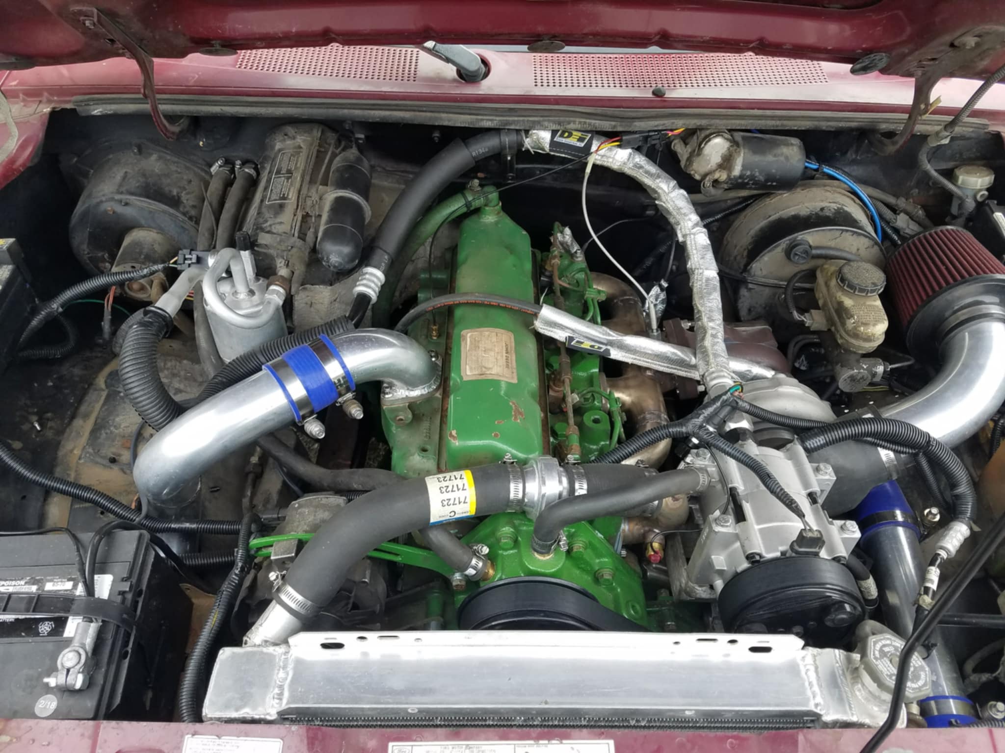 9867ec60-c80c-4831-8f5a-277c79a9dffb John Deere engine-swapped Ford Ranger