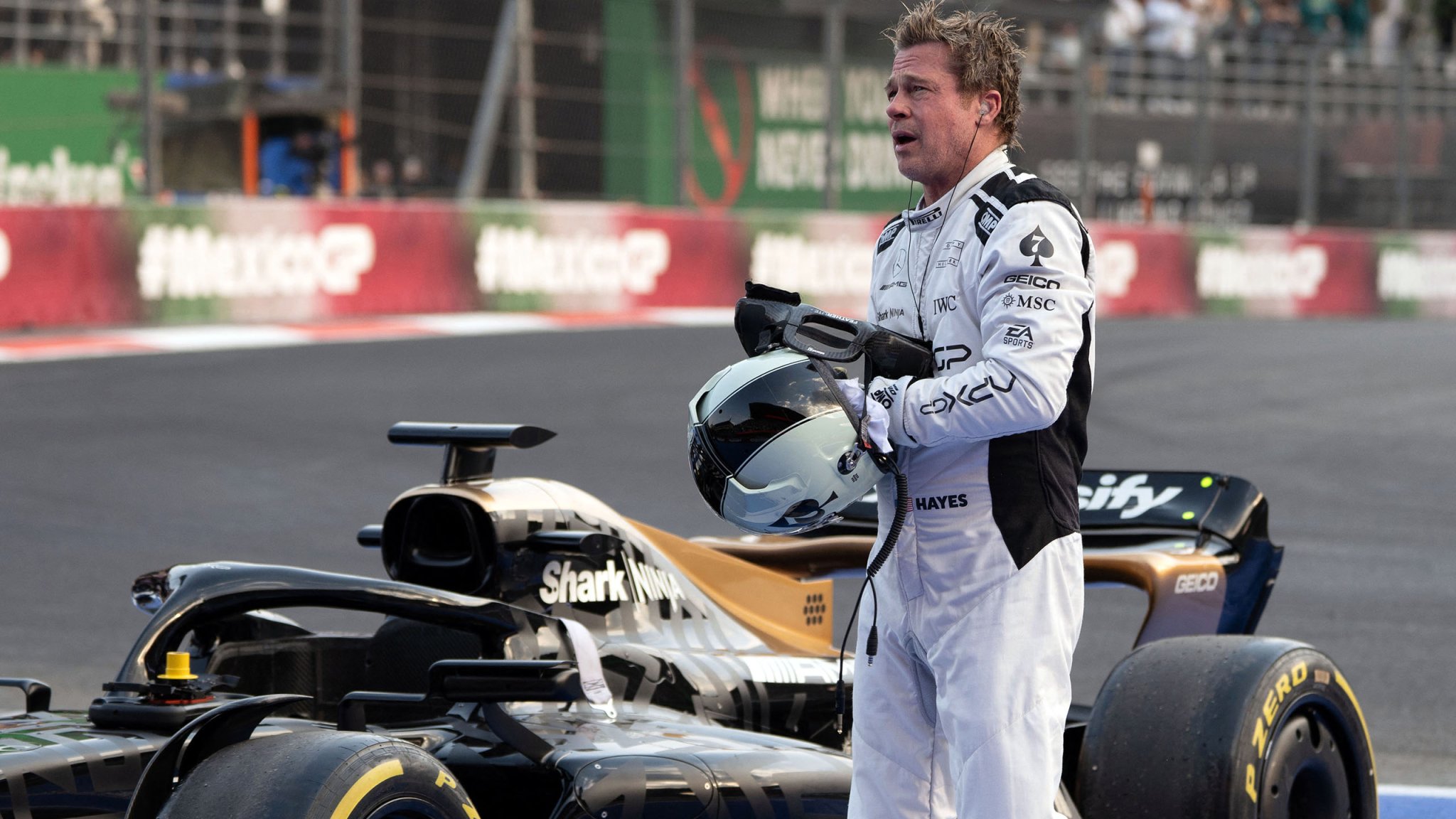 gettyimages-2180557083-copy-1 US actor Brad Pitt performs during the recording of a scene for his new film "F1" directed by Joseph Kosinski during the Formula One Mexico City Grand Prix at the Hermanos Rodriguez racetrack in Mexico City on October 26, 2024. (Photo by LEXIE HARRISON-CRIPPS / AFP) (Photo by LEXIE HARRISON-CRIPPS/AFP via Getty Images)