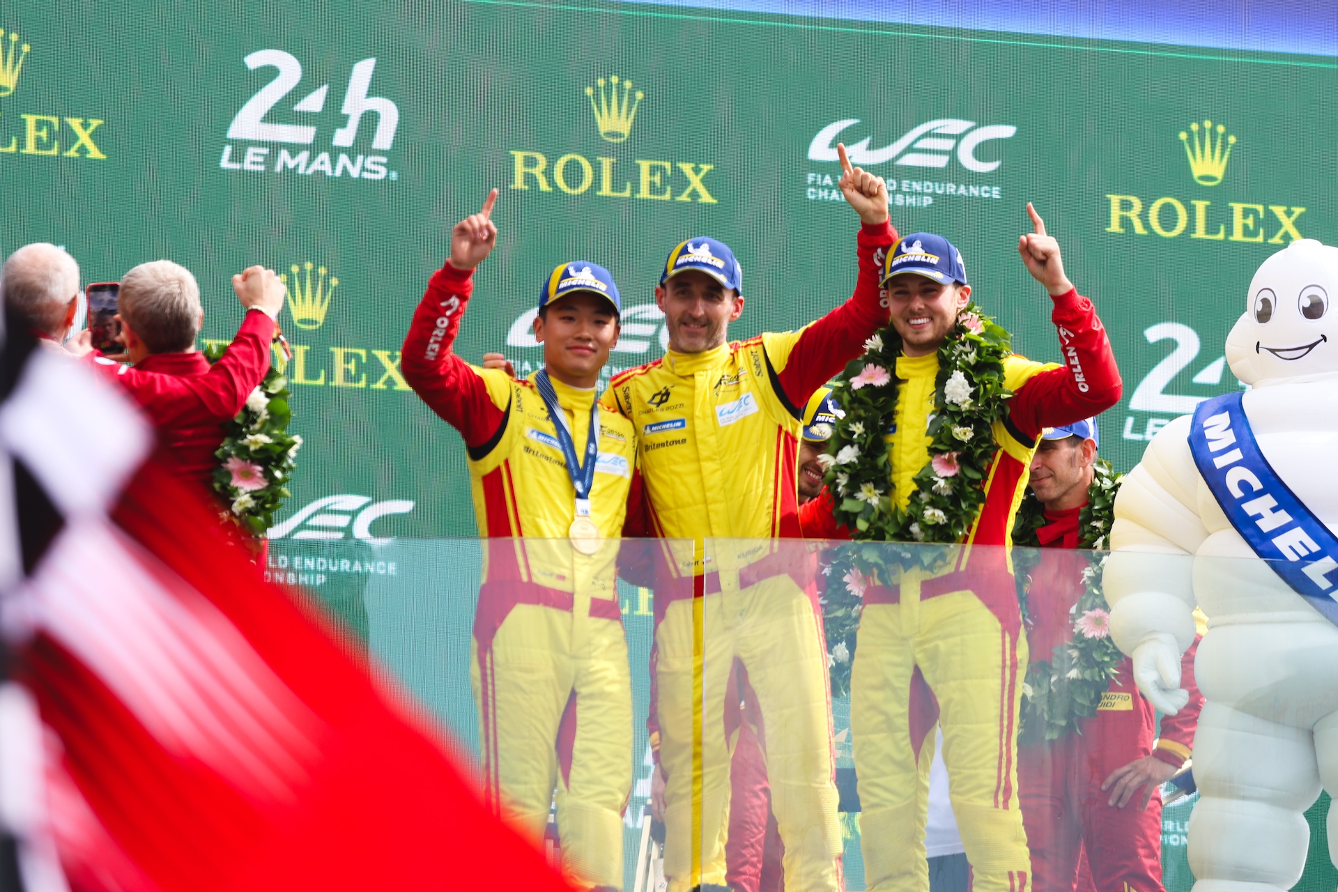 gettyimages-2219638714 AF Corse #83 Yifei Ye (CHN), Robert Kubica (POL), and Phil Hanson (GBR) raise their index fingers in unison after their victory during the FIA World Endurance Championship, WEC 24 Hours of Le Mans 2025 at Circuit de la Sarthe in Le Mans, France, on June 15, 2025. (Photo by Wan Mikhail Roslan/NurPhoto)