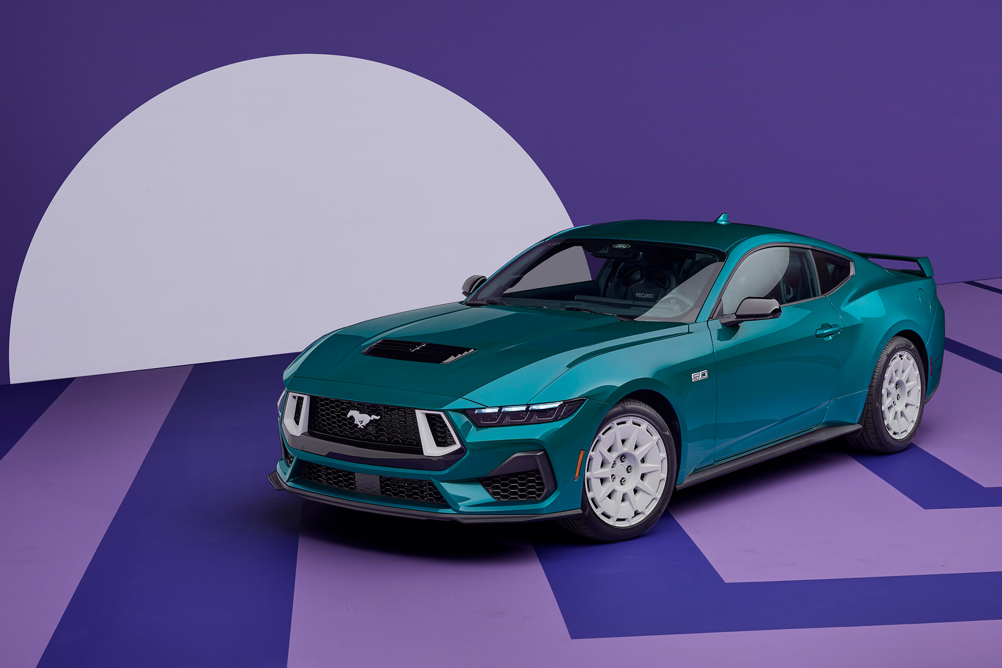 new-fox-mustang-inline-1 2026 Ford Mustang GT with the FX Package sits parked against a purple and white background.