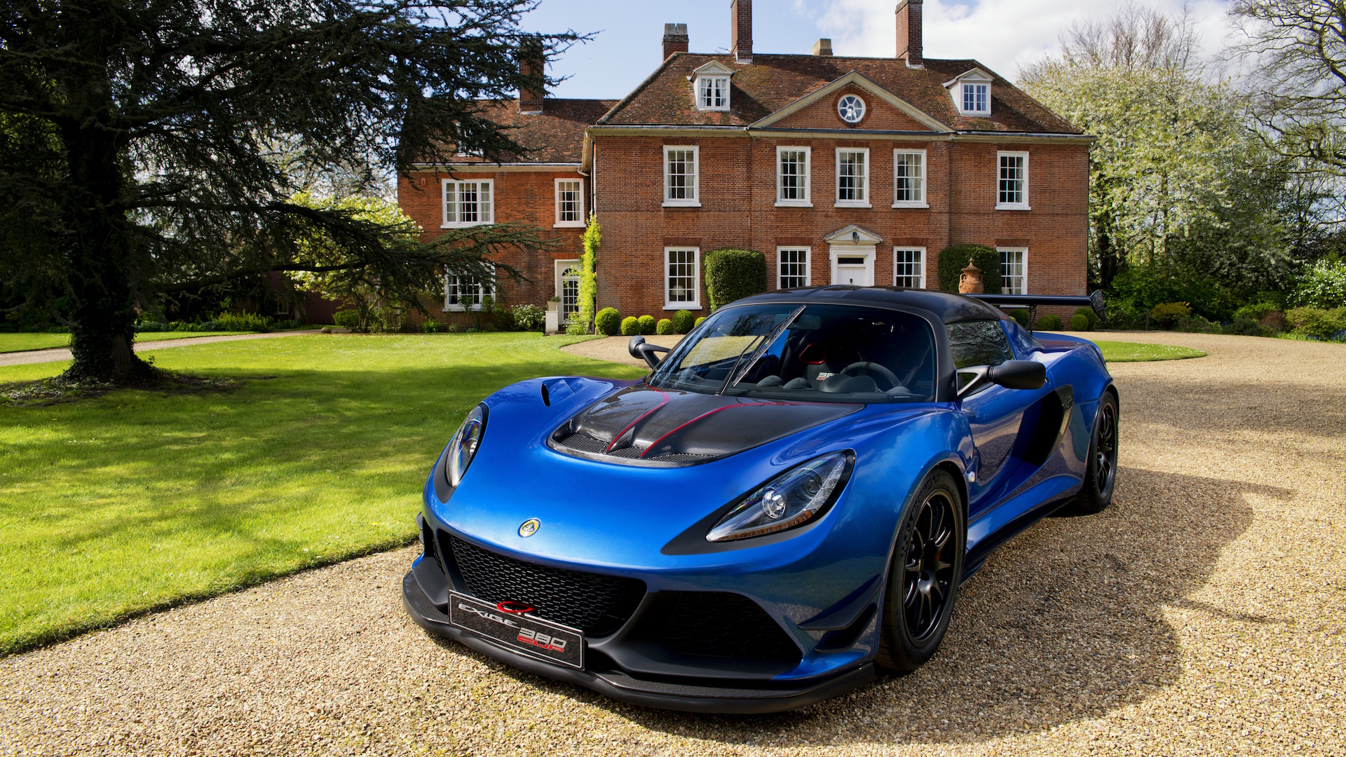 lotus-exige-cup-380-front-3qtrs-1_tn-1 Lotus Exige Cup 380 in front of an English country estate.
